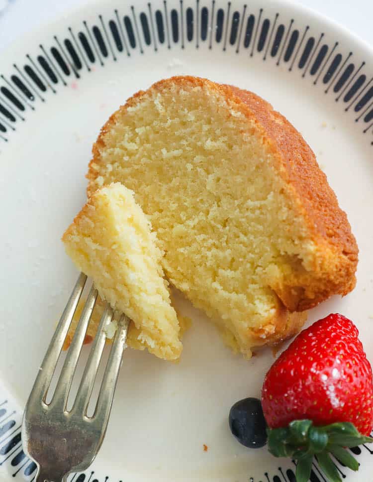 Slice of pound cake and as strawberry on a plate